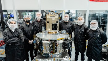 Clean-room team with Orbiter SN3 space tug and Otter Pup docking spacecraft